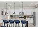 Modern kitchen featuring a granite countertop, stainless steel appliances, and white cabinets at 3962 Lana Ave, Davenport, FL 33897