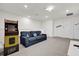 Cozy loft featuring a video game, a comfortable couch, and bright lighting at 3962 Lana Ave, Davenport, FL 33897