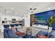 Open-concept living space boasts an accent wall and an eat-in kitchen, creating a cozy and stylish home at 3962 Lana Ave, Davenport, FL 33897