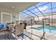 Inviting screened-in pool area with patio furniture and a secure safety fence at 3962 Lana Ave, Davenport, FL 33897
