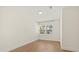 Bright, neutral bedroom with wood-look tile flooring and a window letting in natural light at 4210 Shorecrest Dr, Orlando, FL 32804