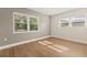 Bedroom featuring neutral walls, wood-look floors, and windows to provide ample natural light at 4210 Shorecrest Dr, Orlando, FL 32804