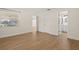 Spacious bedroom with wood-look floors and easy access to the bathroom and the rest of the home at 4210 Shorecrest Dr, Orlando, FL 32804