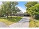 Charming single-story home with a large front yard and a paved driveway at 4210 Shorecrest Dr, Orlando, FL 32804
