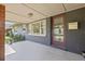 Covered front porch featuring windows, a mailbox, and a glass door at 4210 Shorecrest Dr, Orlando, FL 32804