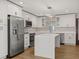 Modern kitchen with stainless steel appliances, white cabinets, and an island at 4210 Shorecrest Dr, Orlando, FL 32804
