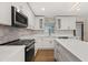 Updated kitchen featuring stainless steel appliances, and white cabinets at 4210 Shorecrest Dr, Orlando, FL 32804