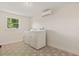 Cozy laundry room features modern washer and dryer, and stylish tiled floor at 4210 Shorecrest Dr, Orlando, FL 32804