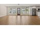 Open concept living area features wood-look floors, natural light, and seamless flow to the kitchen at 4210 Shorecrest Dr, Orlando, FL 32804