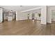 Open-concept living space with wood-look flooring, natural light, and seamless flow to the kitchen at 4210 Shorecrest Dr, Orlando, FL 32804