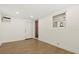 Bright room with wood-look flooring, fresh white walls, window and exterior door at 4210 Shorecrest Dr, Orlando, FL 32804