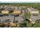 An aerial view showcasing the neighborhood's well-maintained landscaping, with lush green trees at 4579 Lacebark Trl, Oviedo, FL 32765