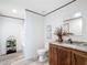Beautiful bathroom featuring a decorative vanity, framed mirror, and a walk-in shower at 5045 Se 148Th St, Summerfield, FL 34491