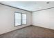 Bright bedroom featuring plush carpeting, fresh neutral paint and large windows at 5045 Se 148Th St, Summerfield, FL 34491