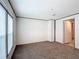 Comfortable bedroom features plush carpeting, fresh neutral paint and a full closet at 5045 Se 148Th St, Summerfield, FL 34491