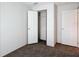 Bedroom with closet and white paneled doors at 5045 Se 148Th St, Summerfield, FL 34491