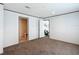 Well-lit bedroom features plush carpeting, fresh neutral paint and an ensuite bathroom at 5045 Se 148Th St, Summerfield, FL 34491