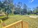 View of the property from the front porch showcasing the yard and neighborhood at 5045 Se 148Th St, Summerfield, FL 34491