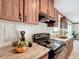 Well-equipped kitchen featuring wood cabinetry, modern appliances, and ample counter space for meal preparation at 5045 Se 148Th St, Summerfield, FL 34491