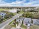 Lovely neighborhood with a beautiful pond in the background and tree-lined streets at 5852 Mariposa Cove Ln, Orlando, FL 32822