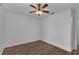 Bright bedroom with hardwood floors and ceiling fan at 5852 Mariposa Cove Ln, Orlando, FL 32822