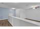 Loft area featuring hardwood floors, neutral paint and a ceiling fan at 5852 Mariposa Cove Ln, Orlando, FL 32822