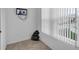 Corner room with tile flooring, window with blinds, and electrical outlets at 5852 Mariposa Cove Ln, Orlando, FL 32822