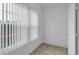 Clean and simple room with tile flooring, a window, and fresh paint at 5852 Mariposa Cove Ln, Orlando, FL 32822