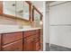 Bathroom with marble-look vanity top, stone tile backsplash, and a wardrobe at 604 Desoto Dr, Casselberry, FL 32707