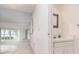 A hallway leads to a bathroom and the main living area with water views at 604 Desoto Dr, Casselberry, FL 32707