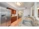 Well-lit kitchen featuring stainless steel appliances, tiled backsplash, and ample countertop space at 604 Desoto Dr, Casselberry, FL 32707