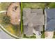 Aerial view of home showcasing its layout, roof, and adjacent playground at 619 Oxford Chase Dr, Winter Garden, FL 34787