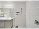 Modern bathroom boasts a luxurious marble-tiled shower with sleek fixtures at 619 Oxford Chase Dr, Winter Garden, FL 34787