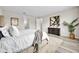 Well-appointed bedroom with soft carpeting, neutral colors, and a cozy atmosphere at 619 Oxford Chase Dr, Winter Garden, FL 34787