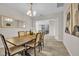 Formal dining room with stylish chairs, hardwood floors, and chandelier lighting at 619 Oxford Chase Dr, Winter Garden, FL 34787