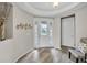 Inviting foyer with hardwood floors, decorative lighting, and modern decor at 619 Oxford Chase Dr, Winter Garden, FL 34787