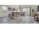 Bright living room with high ceilings, large windows, modern furniture, and stylish decor at 619 Oxford Chase Dr, Winter Garden, FL 34787