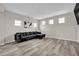 Comfortable living room features plank floors, neutral decor and a comfortable seating arrangement at 619 Oxford Chase Dr, Winter Garden, FL 34787