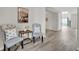 Cozy living room featuring hardwood floors, neutral paint, and comfortable seating at 619 Oxford Chase Dr, Winter Garden, FL 34787