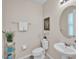 Stylish half bathroom features modern fixtures and neutral decor at 619 Oxford Chase Dr, Winter Garden, FL 34787