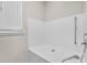 Modern walk-in shower with white tile and updated fixtures at 619 Oxford Chase Dr, Winter Garden, FL 34787