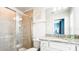 Bathroom featuring glass enclosed shower and granite vanity at 7219 Oakmoss Loop, Davenport, FL 33837