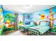 This bedroom features two twin beds and Winnie the Pooh themed decor at 7219 Oakmoss Loop, Davenport, FL 33837