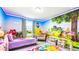 Charming bedroom with two twin beds and delightful Snow White themed mural at 7219 Oakmoss Loop, Davenport, FL 33837