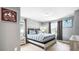 Bedroom with a bed, two side tables, and 'Explore More' wall art at 7219 Oakmoss Loop, Davenport, FL 33837