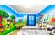 Themed bedroom features two beds, table, and a 'Mickey Mouse' wall decor at 7219 Oakmoss Loop, Davenport, FL 33837