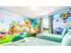 This playful bedroom features two twin beds and Winnie the Pooh themed decor at 7219 Oakmoss Loop, Davenport, FL 33837