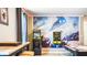 This awesome game room features two vintage video games and a stunning star wars mural at 7219 Oakmoss Loop, Davenport, FL 33837