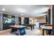 This game room has something for everyone, featuring a pool table, ping pong table, and star wars decor at 7219 Oakmoss Loop, Davenport, FL 33837
