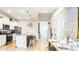 Modern kitchen with stainless steel appliances, granite counters, and an open layout at 7219 Oakmoss Loop, Davenport, FL 33837